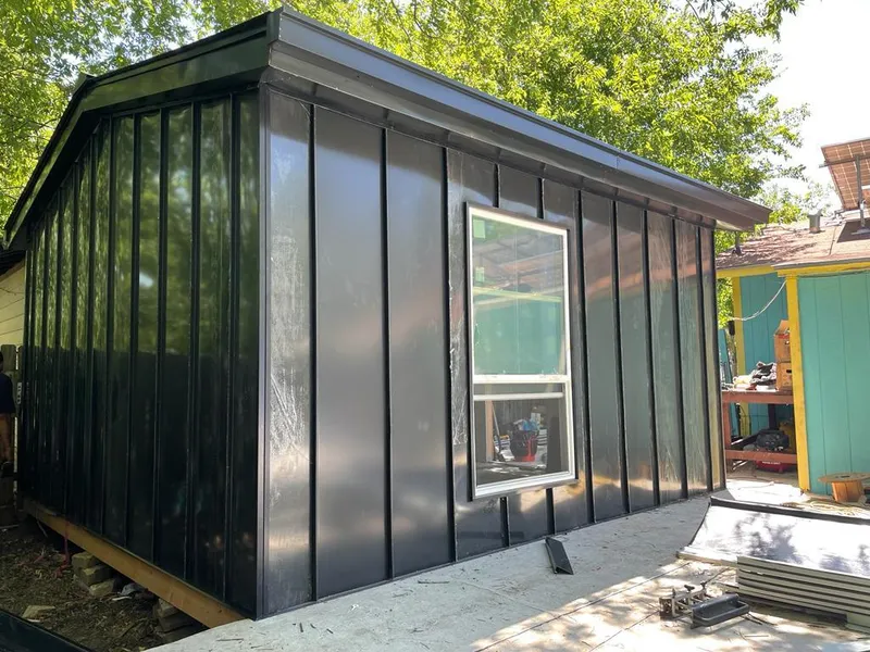 Black standing seam metal wall panels for Roof Inspection in Marana